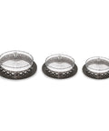 Three decorative metal bowls with intricate designs on a white background