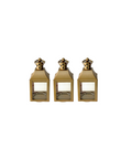 Three small gold-colored lanterns with clear windows, designed to hold candles.