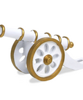 A figurine resembling a Ramadan cannon, with white and gold coloring, on a plain background.