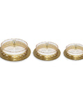 Three golden trays with glass covers on a white background