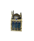 Antique-style metal lantern with blue glass windows and intricate detailing