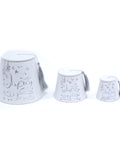 A white porcelain jar with gold hand-painted decorations, including a fez-shaped lid and a gold tassel.