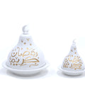 Two ceramic serve dishes with a dome shape, one larger and one smaller, featuring gold hand-painted text and a moon motif.