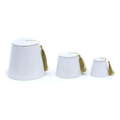 Porcelain fez-shaped canister with classic tarboush design – traditional Arabic décor with timeless elegance.