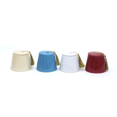 Porcelain fez-shaped canister with classic tarboush design – traditional Arabic décor with timeless elegance.