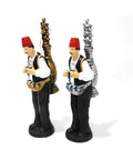 Figurine of a man in traditional attire serving licorice juice – seasonal Arabic décor with cultural charm.