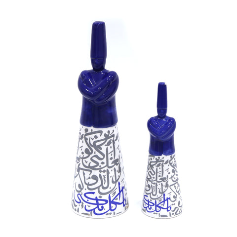 Porcelain dervish figurine with Arabic calligraphy accents – graceful Islamic décor blending spirituality and art.