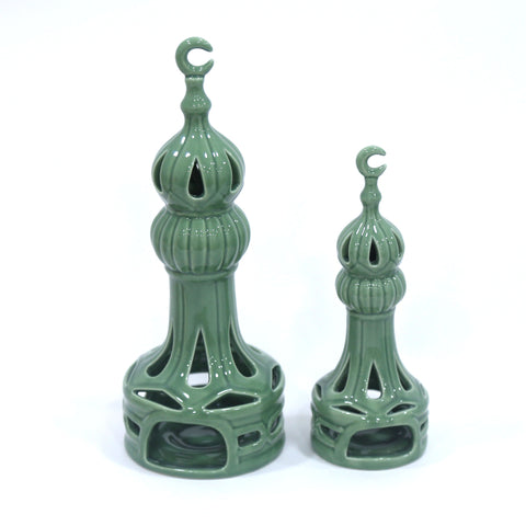 Porcelain candle holder shaped like a minaret – elegant Islamic décor accent with hand-painted details.