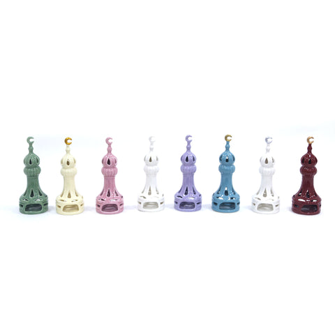 Porcelain candle holder shaped like a minaret – elegant Islamic décor accent with hand-painted details.