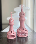 Porcelain candle holder shaped like a minaret – elegant Islamic décor accent with hand-painted details.