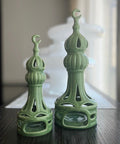 Porcelain candle holder shaped like a minaret – elegant Islamic décor accent with hand-painted details.