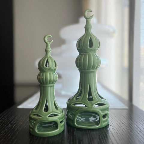 Porcelain candle holder shaped like a minaret – elegant Islamic décor accent with hand-painted details.