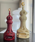 Porcelain candle holder shaped like a minaret – elegant Islamic décor accent with hand-painted details.