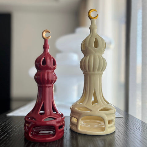 Porcelain candle holder shaped like a minaret – elegant Islamic décor accent with hand-painted details.