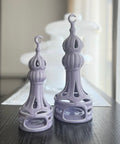 Porcelain candle holder shaped like a minaret – elegant Islamic décor accent with hand-painted details.