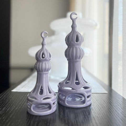 Porcelain candle holder shaped like a minaret – elegant Islamic décor accent with hand-painted details.