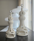 Porcelain candle holder shaped like a minaret – elegant Islamic décor accent with hand-painted details.