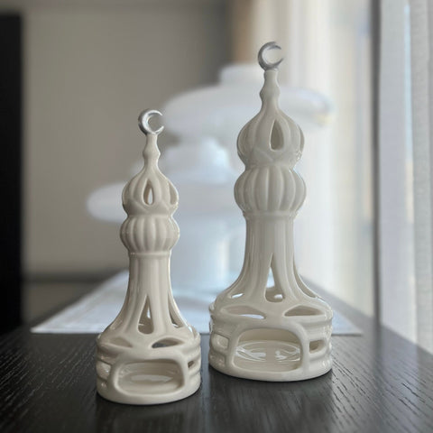 Porcelain candle holder shaped like a minaret – elegant Islamic décor accent with hand-painted details.