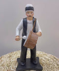 Figurine of traditional Ramadan mesaharati drummer – nostalgic Islamic décor accent from Arab heritage.