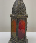 Decorative lantern on a table with a white background