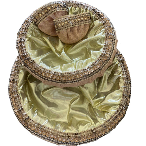 Decorative baby booties in a embellished box on a white background