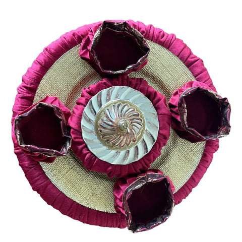 Decorative plate with pink rim and central floral design on a white background