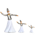 A set of Whirling Dervish figurines in silver and white attire, available in three different sizes.