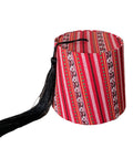 A fabric tarboush box with a striped pattern, featuring a hanging tassel.