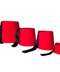 Red fez hats with black tassels on a white background