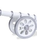 A figurine resembling a Ramadan cannon, with white and silver coloring, on a plain background.