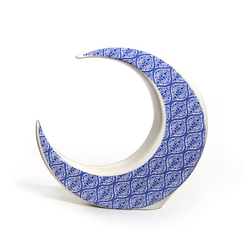 Porcelain moon-shaped figurine with hand-painted Azul pattern – serene Arabic décor with Mediterranean influence.