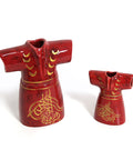Porcelain kaftan-shaped canister with Arabic calligraphy – elegant Arabic decor blending function and heritage.