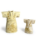 Porcelain kaftan-shaped canister with Arabic calligraphy – elegant Arabic decor blending function and heritage.