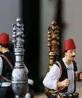 Figurine of a man in traditional attire serving licorice juice – seasonal Arabic décor with cultural charm.