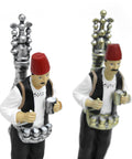 Figurine of a man in traditional attire serving licorice juice – seasonal Arabic décor with cultural charm.