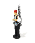 Figurine of a man in traditional attire serving licorice juice – seasonal Arabic décor with cultural charm.