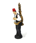 Figurine of a man in traditional attire serving licorice juice – seasonal Arabic décor with cultural charm.