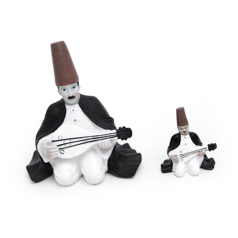 Figurine of a seated man playing the oud in traditional attire – artistic Arabic décor from the FERQA Collection.
