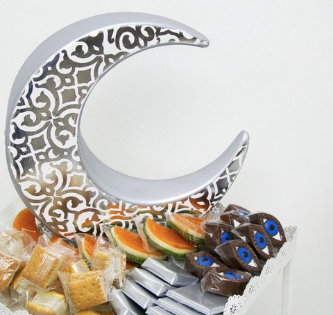 Porcelain moon-shaped figurine with oriental pattern – celestial Arabic décor with artistic cultural detailing.