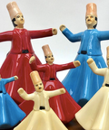 Porcelain figurine of a Mawlawi whirling dervish in white attire – graceful Islamic décor inspired by Sufi tradition.