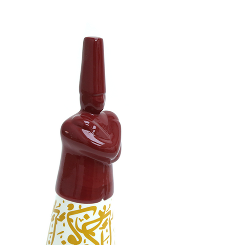 Porcelain dervish figurine with Arabic calligraphy accents – graceful Islamic décor blending spirituality and art.