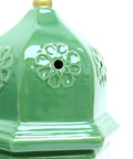 Porcelain candle holder shaped like a mosque with arabesque design – refined Islamic décor for spiritual ambiance.