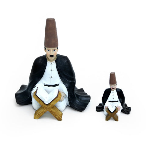 Figurine of a man reading the Holy Quran in traditional attire – reflective Islamic décor from the FERQA Collection.