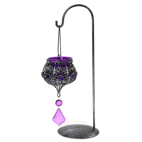Vintage hanging candle holder adorned with beads and stones – ornate lantern décor for warm, festive ambiance.