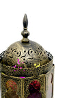 Decorative lantern with intricate designs on a white background