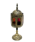 Decorative vintage lantern with intricate designs on a white background