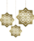 Three gold geometric star-shaped decorations on a white background