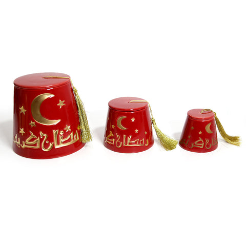 Fez-shaped porcelain canister with gold tassel and Ramadan Kareem calligraphy – elegant Ramadan décor accent.